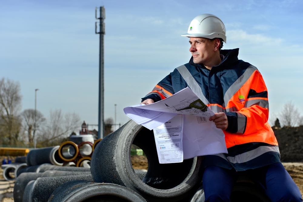 Employee portrait made on location for Watergroep, shot in available industrial light