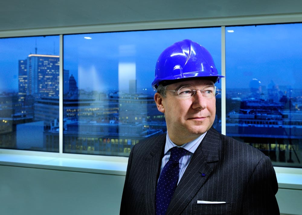 Executive portrait of Serge Fautre of Cofinimmo, lit in a corporate setting